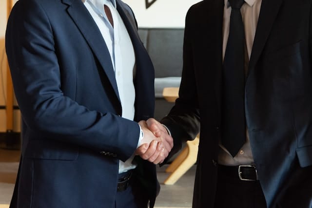 Business handshake confirming a partnership.